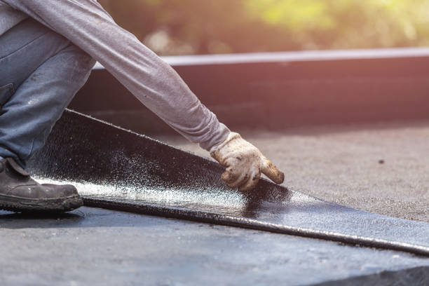 Professional Basement Waterproofing technician working in Morrisville, NY